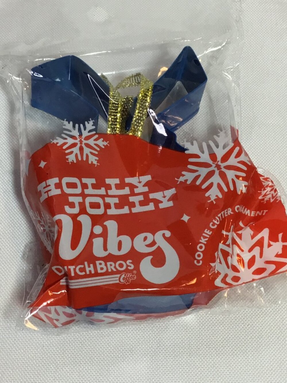 Dutch Bros Limited Edition "Holly Jolly Vibes" Windmill Cookie Cutter Ornament.